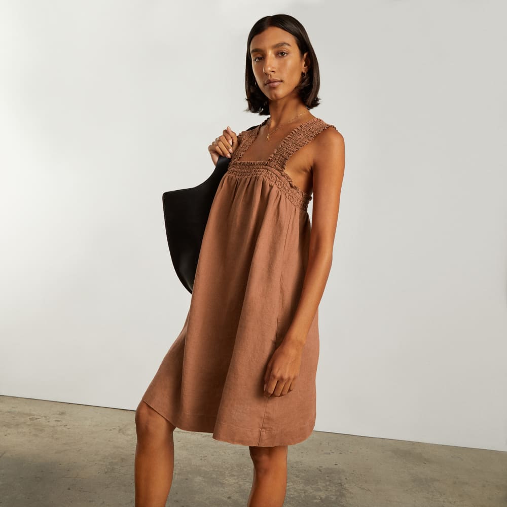 The Smocked Linen Dress in Tawny Brown — detail view