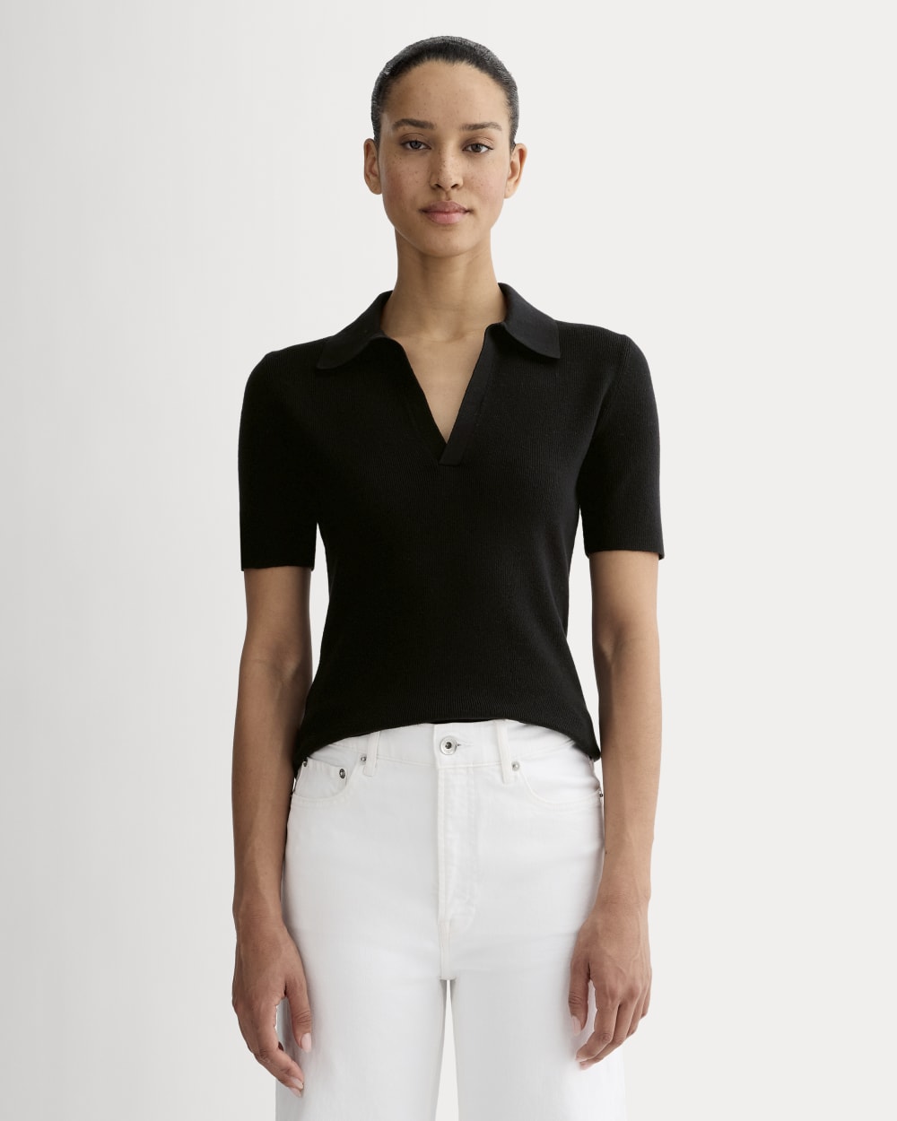 The Knit Polo in Black — front view