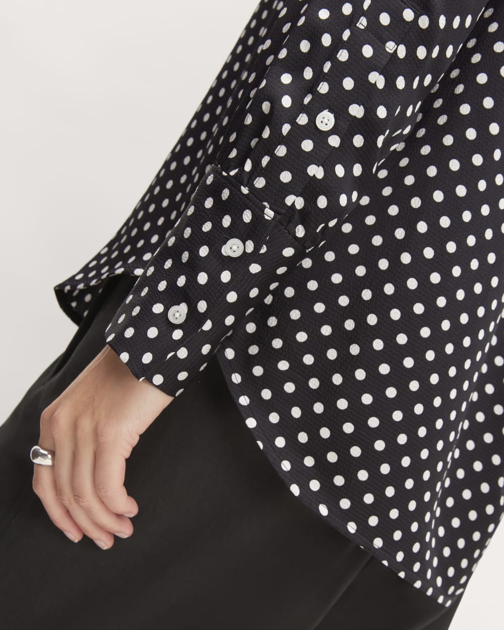 The Hammered Satin Popover Shirt in Black / Bone Polka Dot — detail view